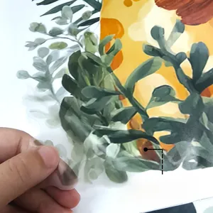Detail of transparent PVC flower wall sticker showing adhesive backing and removable texture