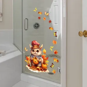 Detail of cute squirrel sticker with pumpkin and maple leaves on glass shower door