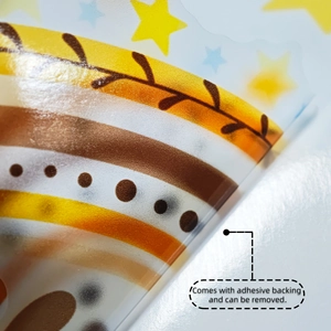 Detail of self-adhesive bohemian rainbow wall sticker showing peeling edge and texture