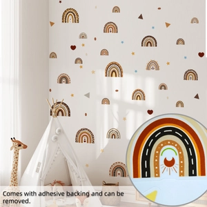 Detail view of Bohemian rainbow wall stickers with stars and hearts on a nursery wall