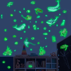 Luminous marine animal wall stickers featuring whales and sea turtles in green glow