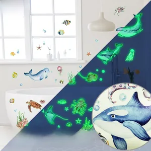 Luminous marine animal wall stickers showing daytime look and glowing night effect in bathroom