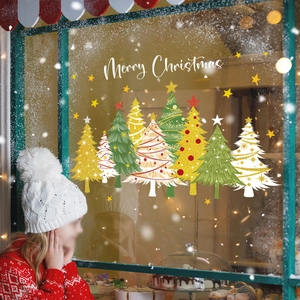 Detail of glitter Christmas tree and Merry Christmas lettering window cling stickers