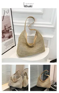 Detail of khaki woven straw tote bag featuring intricate mesh texture and reinforced straps