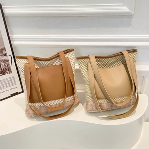 Large woven tote bag with contrast leather pocket for beach holiday and commuting