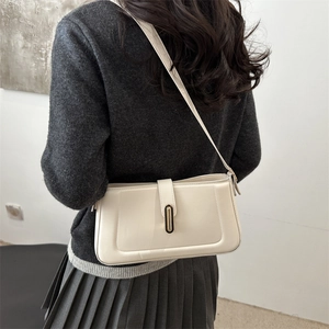 Minimalist cream white leather underarm shoulder bag with a gold metal buckle for women