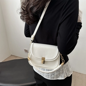 Vintage white faux leather crossbody saddle bag with gold metal buckle and strap