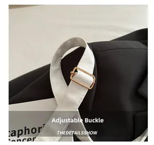 Close-up of white adjustable faux leather strap with premium gold metal buckle detail