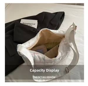 Detail view of the white quilted tote bag interior showing large capacity for daily items
