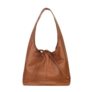 Brown faux leather tote bag with stylish bow accent and wide shoulder strap