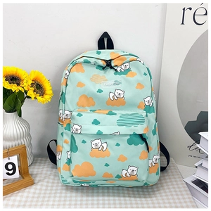Détail du sac à dos dinosaure vert avec motifs ours polaires et poignée robuste