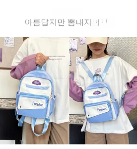 Detailed views of light blue contrast backpack with front pocket and side pockets
