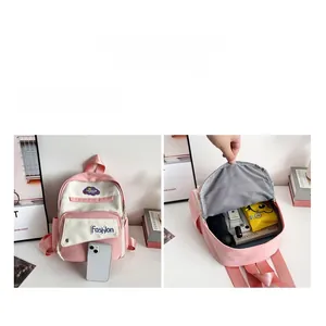 Detail view of pink and white canvas mini backpack showing storage capacity for small essentials