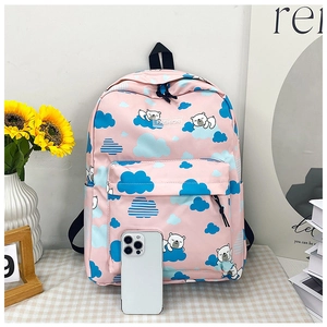 Détail du sac à dos dinosaure rose avec motifs d'ours et smartphone pour référence de taille