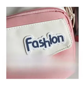 Detail of pink and white canvas bag showing the Fashion logo and clean stitching