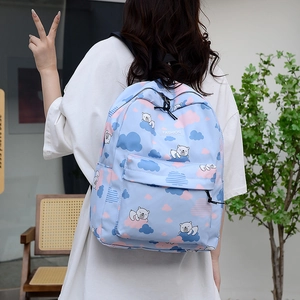 Sac à dos dinosaure bleu clair avec imprimés ours et étiquette mode pour l'école