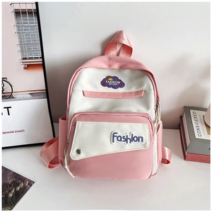 Close-up of pink and white color-block nylon backpack with fashion sport cloud patches