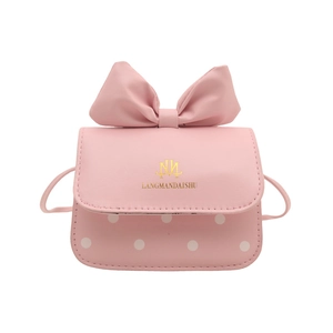 Mini sac à bandoulière rose avec décoration gros nœud et motifs à pois blancs