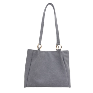 Minimalist grey twill canvas tote bag with gold metal rings and dual shoulder straps