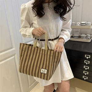 Brown striped corduroy tote bag with CAMPING label for casual daily commute
