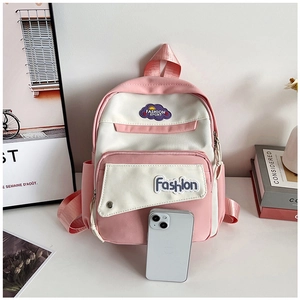 Detail of pink and white contrast backpack with fashion label and side pocket storage