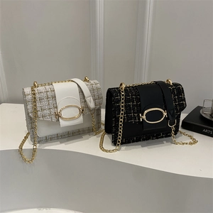 Elegant tweed chain crossbody bag set in white and black with gold metal hardware buckle