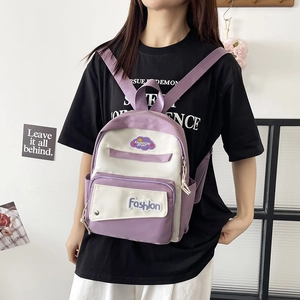 Minimalist purple and white color-block backpack for women with front zipper pockets