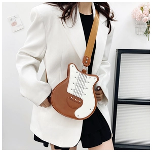Detailed view of guitar-shaped crossbody bag featuring premium brown and beige leather patchwork