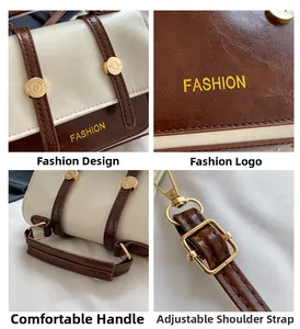 Detail view of the bicolor faux leather handbag showing stitching and metal closure