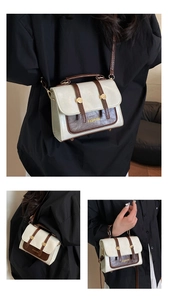 Detail shots of white and brown wax leather crossbody bag with golden hardware