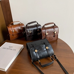 Vintage college style satchel bags in four colors with star stitching and top handles