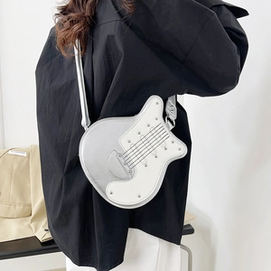Unique silver and white guitar-shaped crossbody bag with stylish rivet details for women
