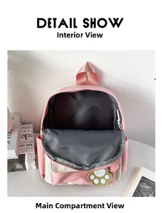 Detail view of the spacious inner main compartment in a pink and white backpack