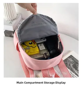Top view of pink backpack main compartment showing high capacity storage for daily items