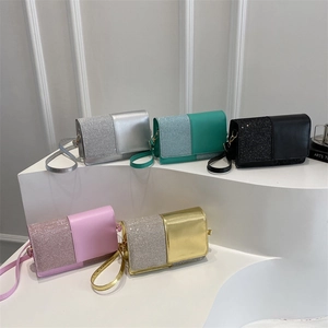 Minimalist sequin patchwork shoulder bags in five colors on display stand