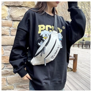 Close-up of cream canvas crescent crossbody bag with black TEVGRUN7 letter print detail