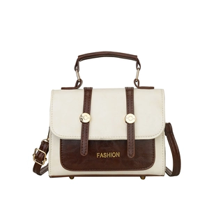 Contrast color vintage crossbody bag in beige and brown with adjustable strap and top handle