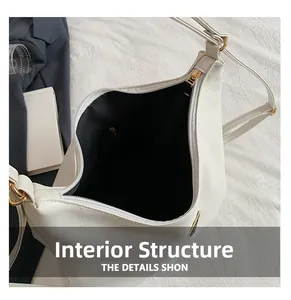 Detail view of the spacious black fabric lining and internal structure of white tote bag