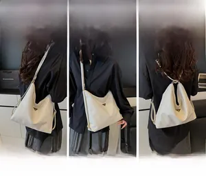 Three-way styling detail of white leather tote bag as shoulder, crossbody and backpack