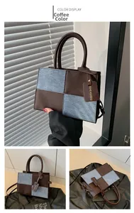 Detail of coffee brown leather and blue denim patchwork square bag with mini logo tag