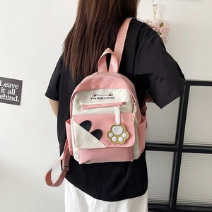 Cute pink and white cat-themed backpack with fashion logo for students and daily casual use