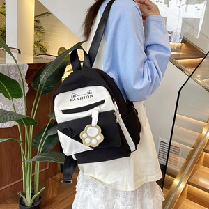 Black and white canvas backpack with cat ear design and paw pendant for students