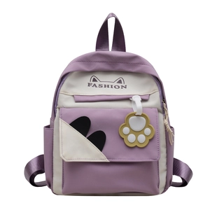 Cute purple and beige cat-themed backpack with cartoon ears and 3D paw charm for girls