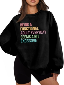 Detail of black thick warm sweatshirt featuring funny Being a Functional Adult text print