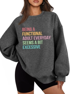 Detail of soft charcoal grey fabric and colorful adult slogan print on casual sweatshirt