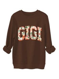 Détail de l'imprimé floral GIGI sur sweat marron avec revers aux poignets