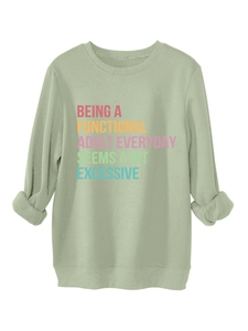 Close-up of light green crewneck sweatshirt with ribbed cuffs and colorful typography