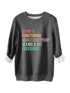 Close-up of dark grey sweatshirt showing colorful slogan print and thick fleece lining