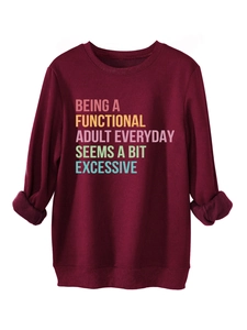 Detail of burgundy thick sweatshirt featuring cuff fold design and colorful slogan print