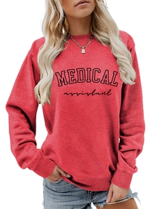 Detail of red crewneck sweatshirt featuring black Medical Assistant printed text